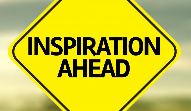 a sign which says "inspiration ahead"